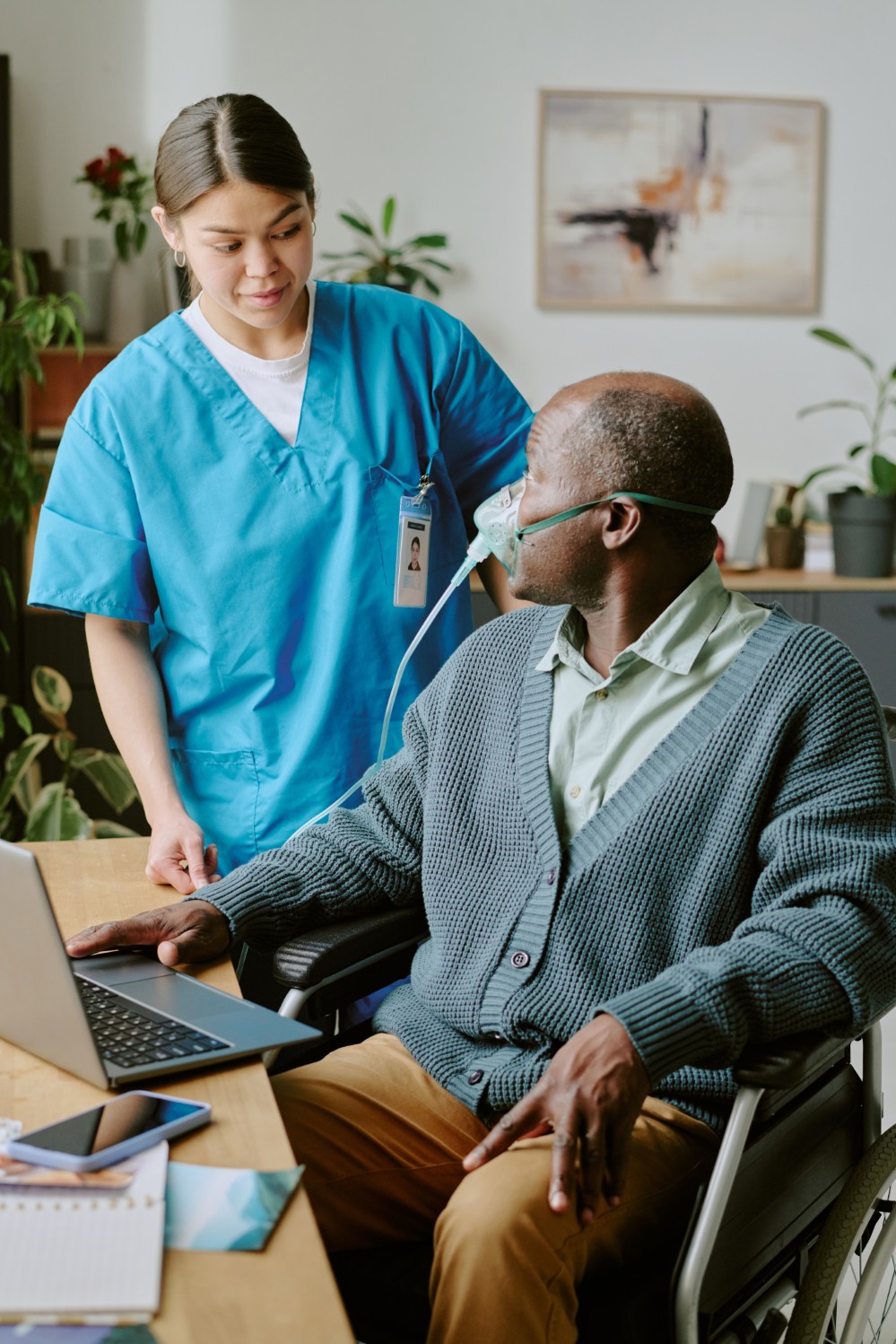 A caregiver supporting an older adult in New London